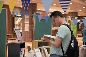 A student browsing the books that are on display